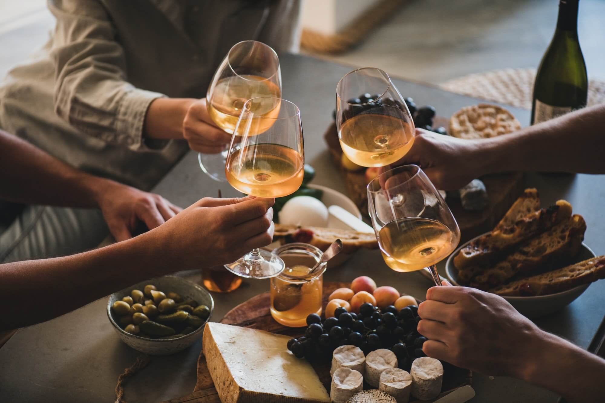 friends-having-wine-tasting-or-celebrating-event-with-wine.jpg